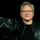 Never without his leather, Nvidia CEO Jensen Huang holds up an RTX 4090 GPU.